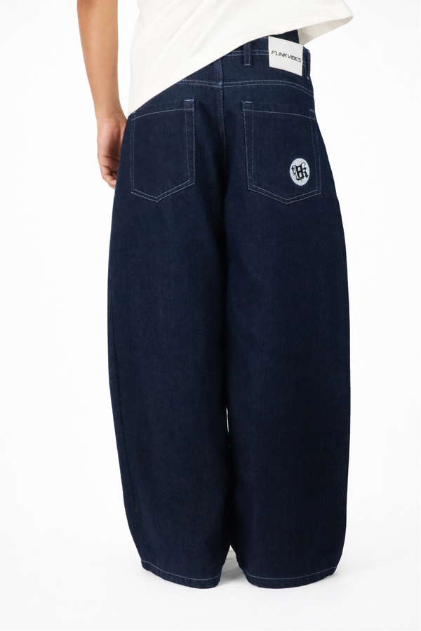 Navy wide-leg jeans with a brand logo on a white background