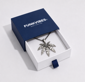 Silver leaf pendant necklace in a 'Funkvibes' box on a light gray background
