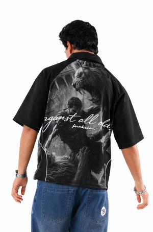 Person wearing a black graphic t-shirt with text and blue jeans on a white background