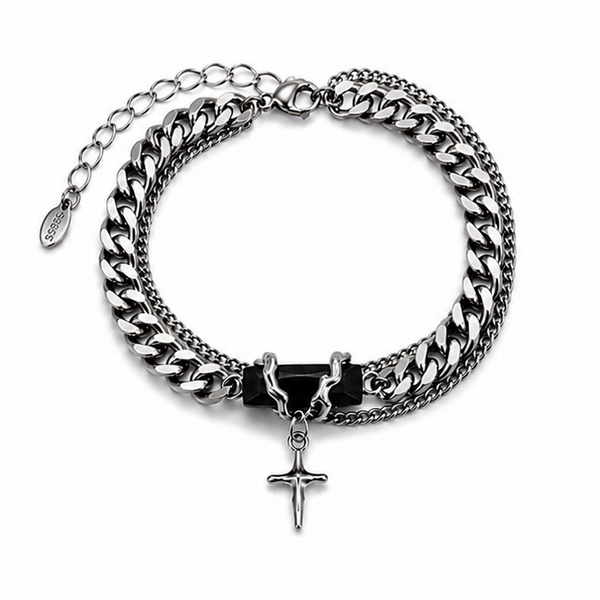 Silver chain bracelet with a cross pendant on a white background