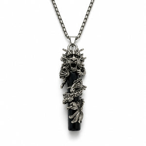 Decorative necklace with intricate designs on a white background