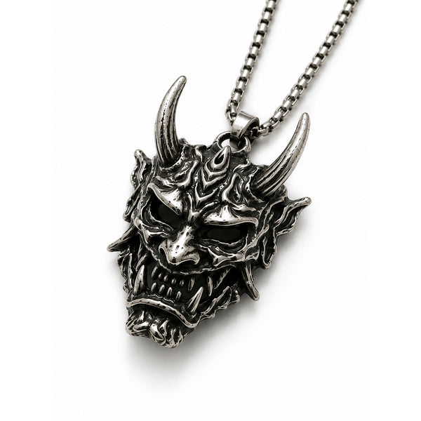Silver dragon head necklace on a white background